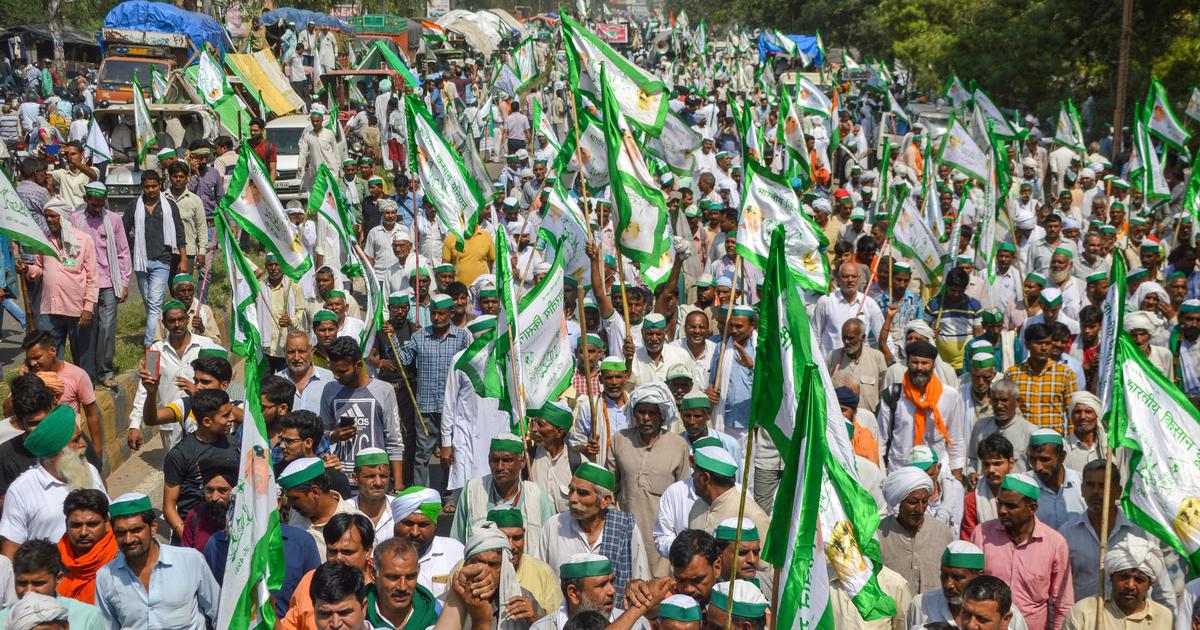 Massive BKU farmer rally — thousands of farmers with green flags assembled in an open field